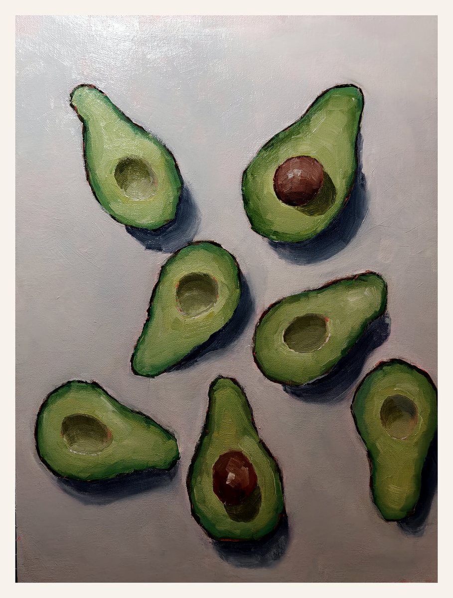 Oil painting of several avocado halves arranged on a pale surface